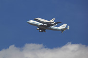 Endeavour and its Boeing 747 break from behind the trees. Click for a larger image.