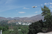 A composite image of Endeavour over JPL. Click for a larger image.